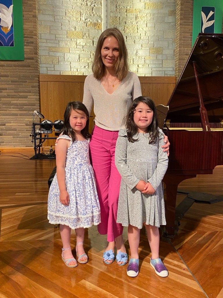 Maria with students after a performance